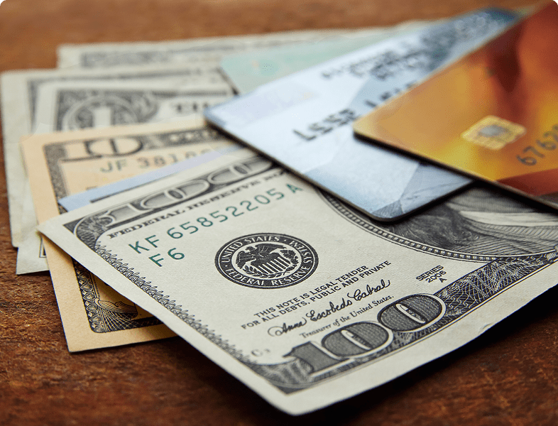Cash and credit cards on table