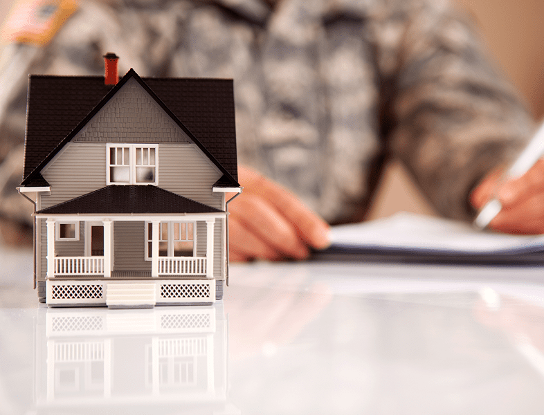 Small house model on reflective surface
