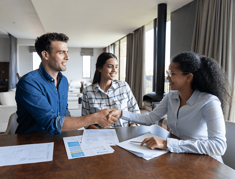 Business meeting handshake with couple